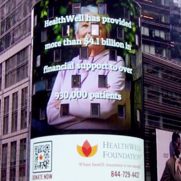 New York City Time Square advertisement showing HealthWell data helping Americans.