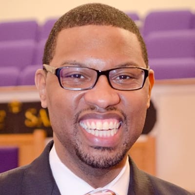 African American college student with a big smile.